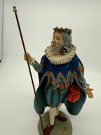 Vintage 1985 Duncan Royale Sir Christmas figurine – front view with staff, showing the full costume, teal trunk hose and burgundy shoes with gold rosettes