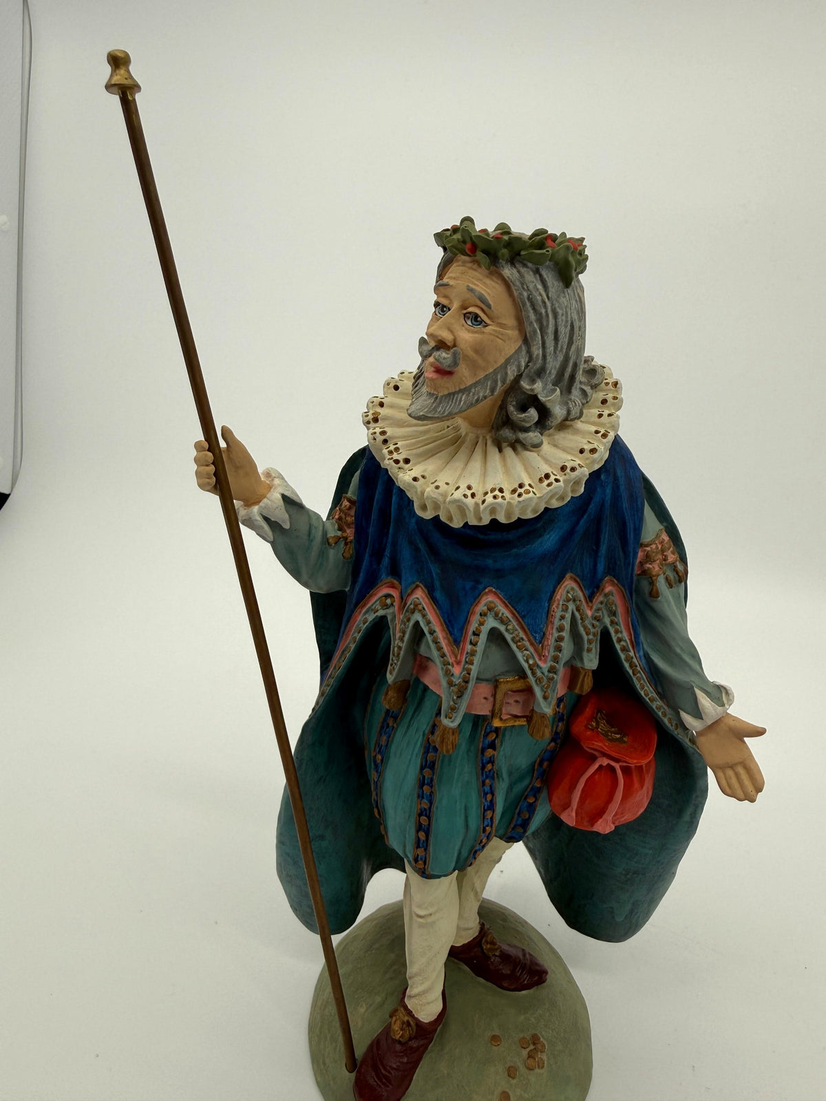 Vintage 1985 Duncan Royale Sir Christmas figurine – front view with staff, showing the full costume, teal trunk hose and burgundy shoes with gold rosettes