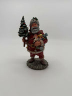 Vintage 1991 Duncan Royale Today's Nast Santa figurine – full front view, striding across the rocky, snow-dusted base