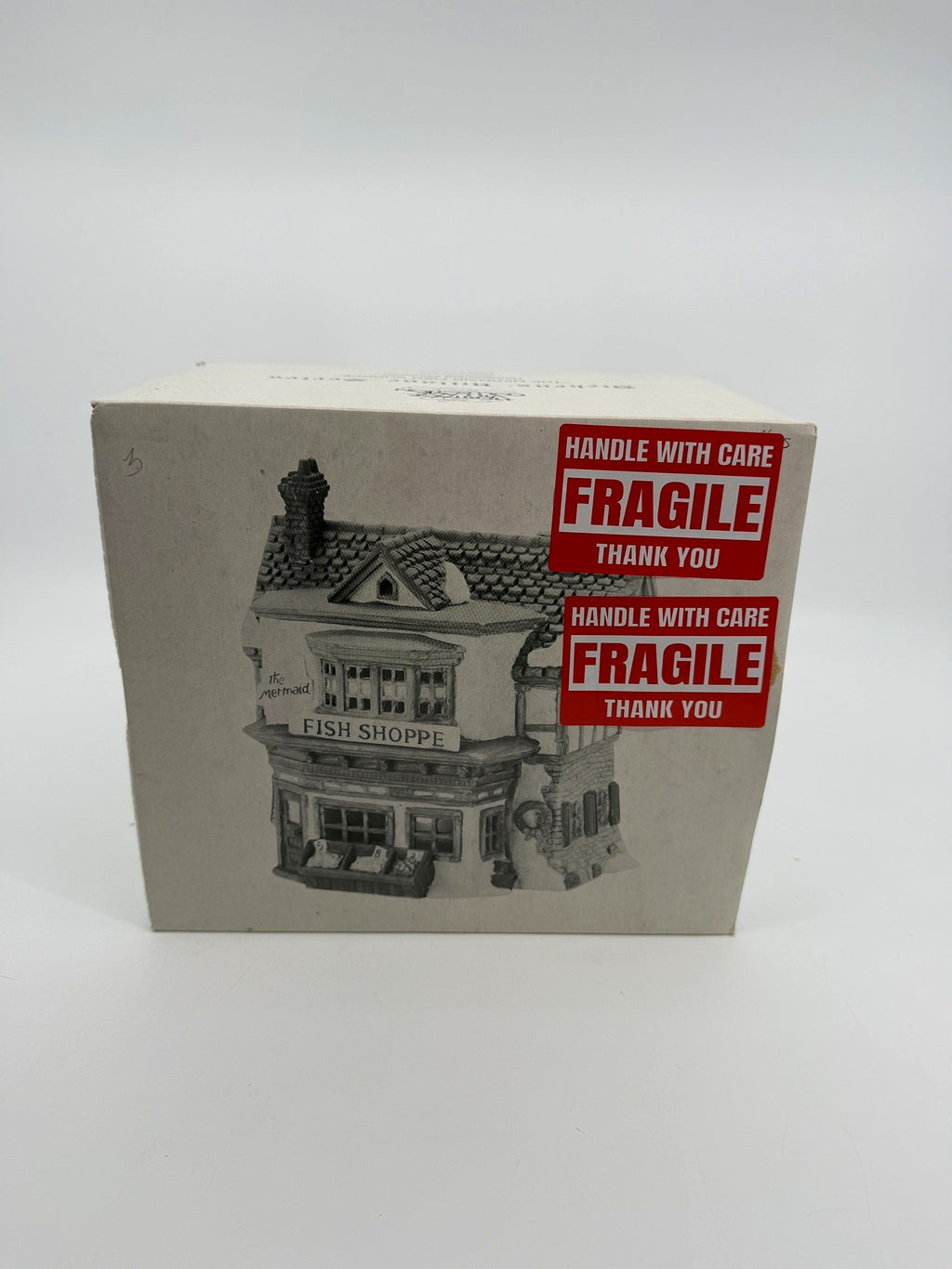 Department 56 Dickens' Village The Mermaid Fish Shoppe #5926-9 — original box front with the printed shop illustration and FRAGILE stickers