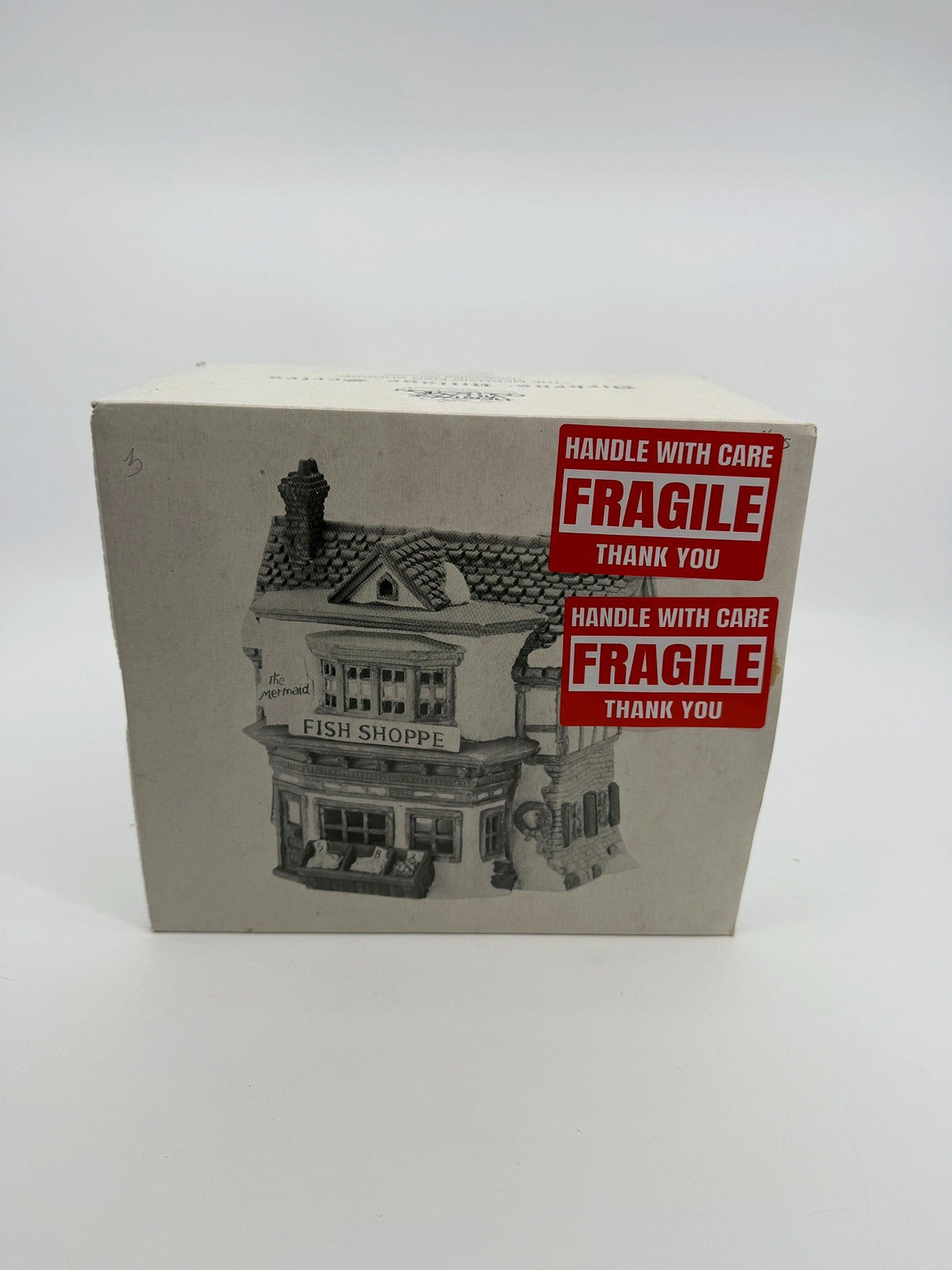Department 56 Dickens' Village The Mermaid Fish Shoppe #5926-9 — original box front with the printed shop illustration and FRAGILE stickers