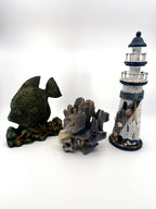 Blue coral specimen on natural base, coastal decor — styled with a fish figurine and a lighthouse for scale — props not included