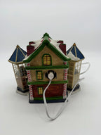 Back of the Child's Wonder Candy Shop showing the C7 bulb socket, white power cord, and the embossed 2005 Carole Towne mark