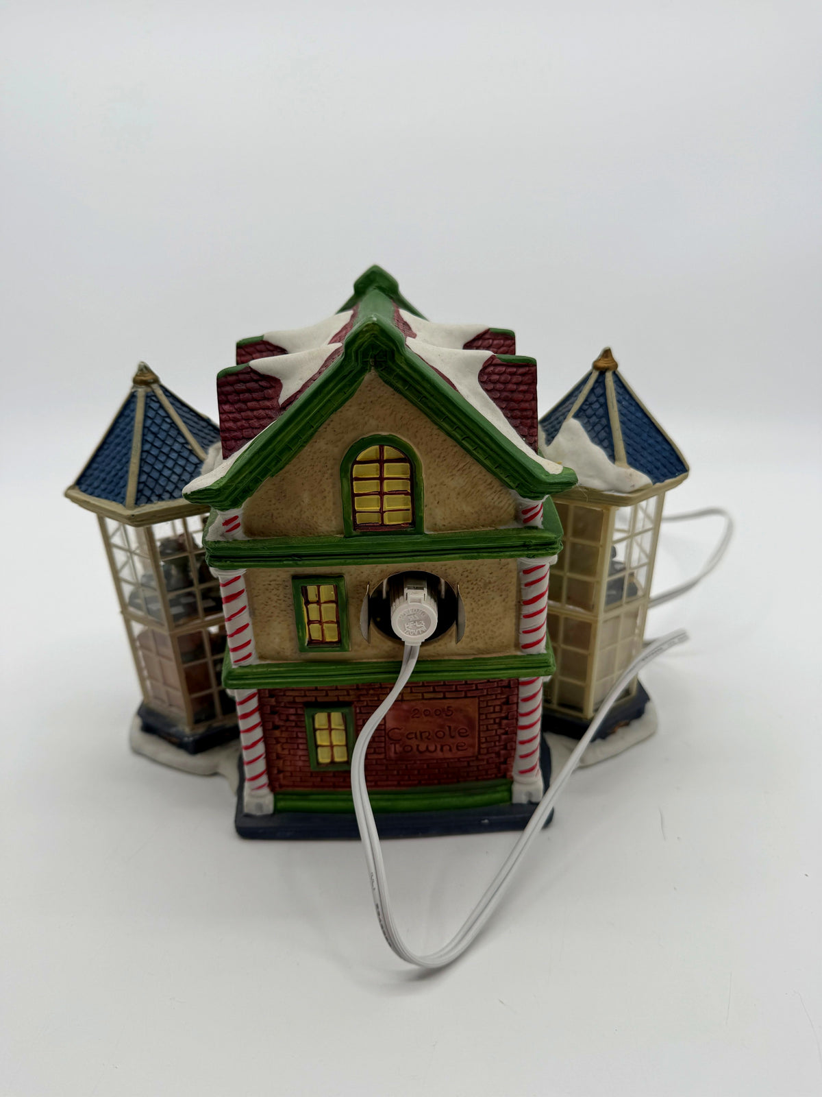 Back of the Child's Wonder Candy Shop showing the C7 bulb socket, white power cord, and the embossed 2005 Carole Towne mark