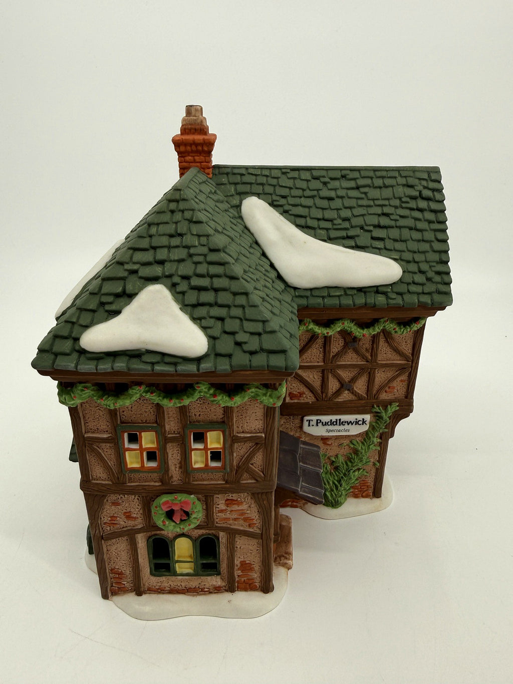 Department 56 Dickens' Village T. Puddlewick Spectacle Shop #58334 — front three-quarter view from the sign side