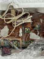 Department 56 Dickens' Village The Christmas Carol Cottage #58339 — close view of the wrapped cottage front and its original light cord