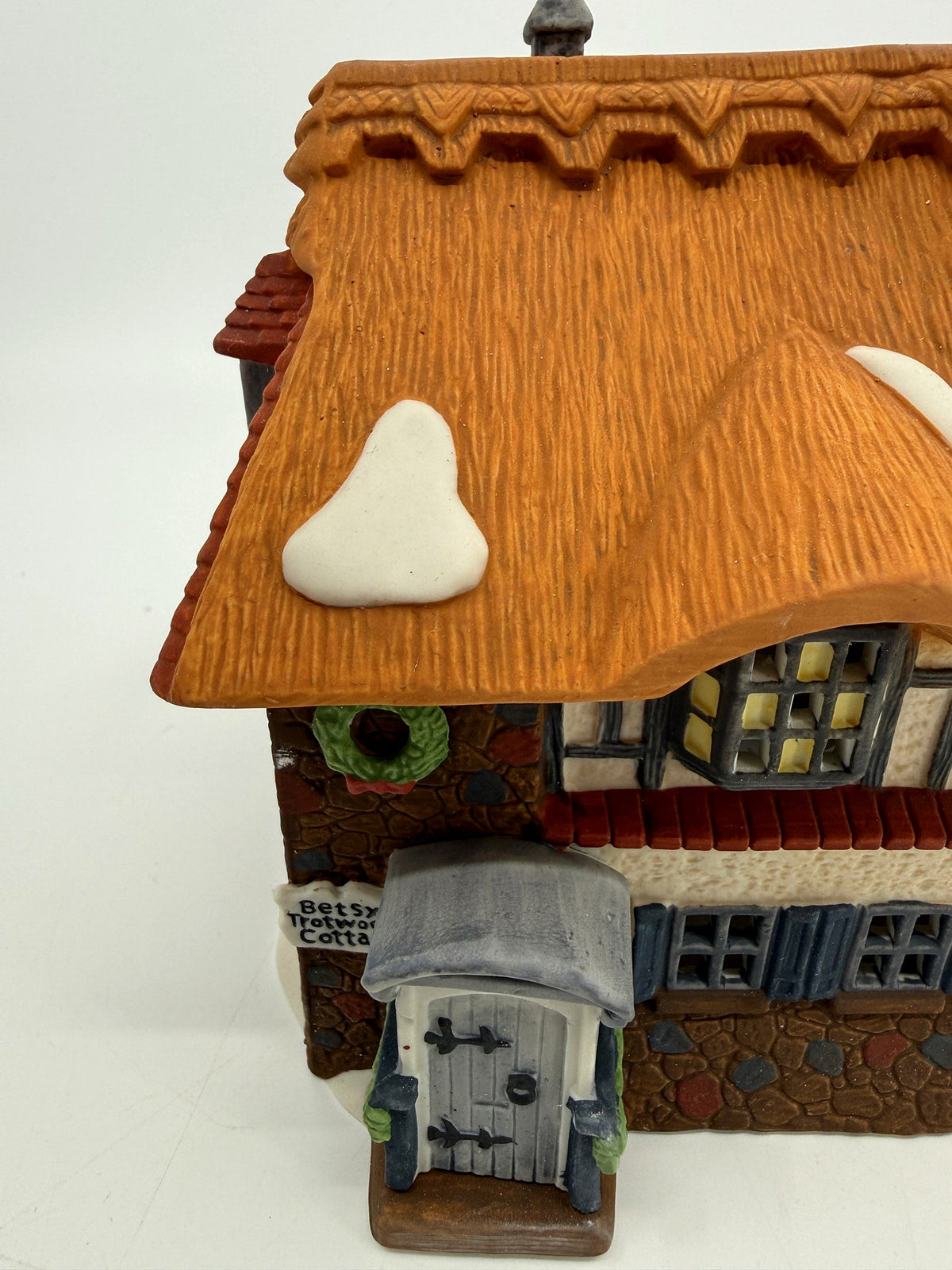 Department 56 Dickens' Village Betsy Trotwood's Cottage #5550-6, David Copperfield — close view of the front facade, porch, and cottage sign