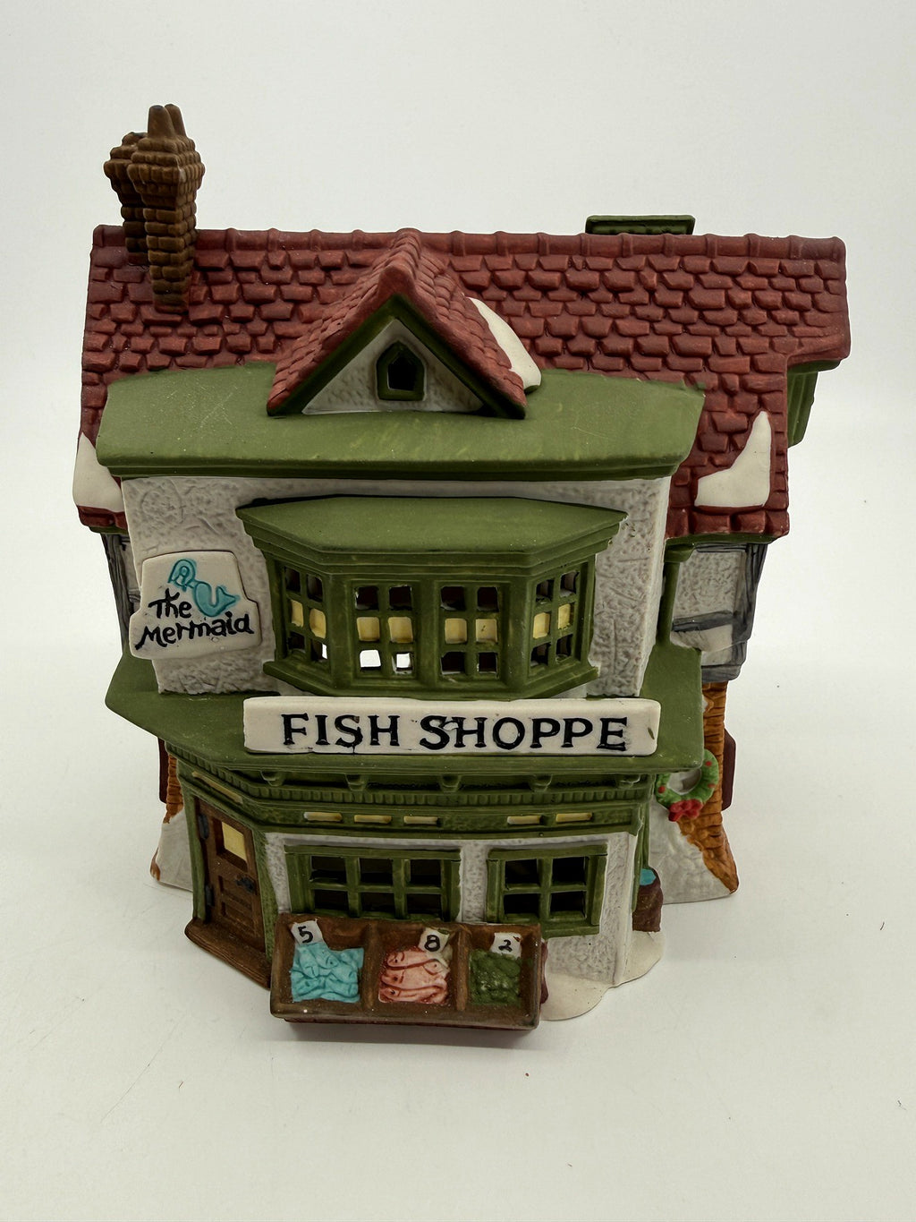 Department 56 Dickens' Village The Mermaid Fish Shoppe #5926-9 — front view: green bay window, The Mermaid sign, FISH SHOPPE storefront