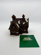 The cottage in its protective packaging with the Heritage Village Collection booklet