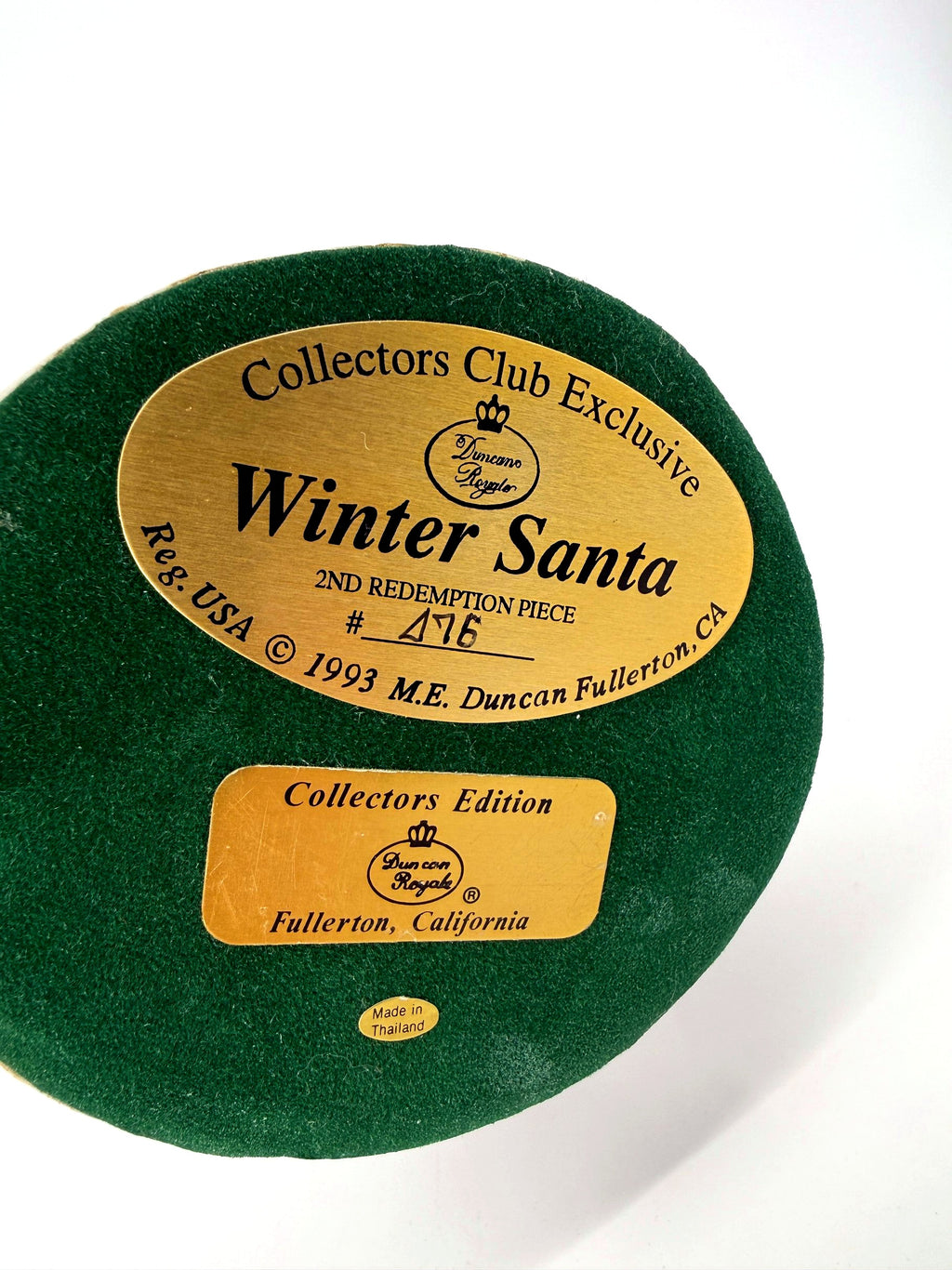Underside of the base — green felt with gold Duncan Royale labels: Winter Santa, Collectors Club Exclusive, 2nd Redemption Piece, individually numbered, © 1993 M.E. Duncan, Fullerton CA, Made in Thailand