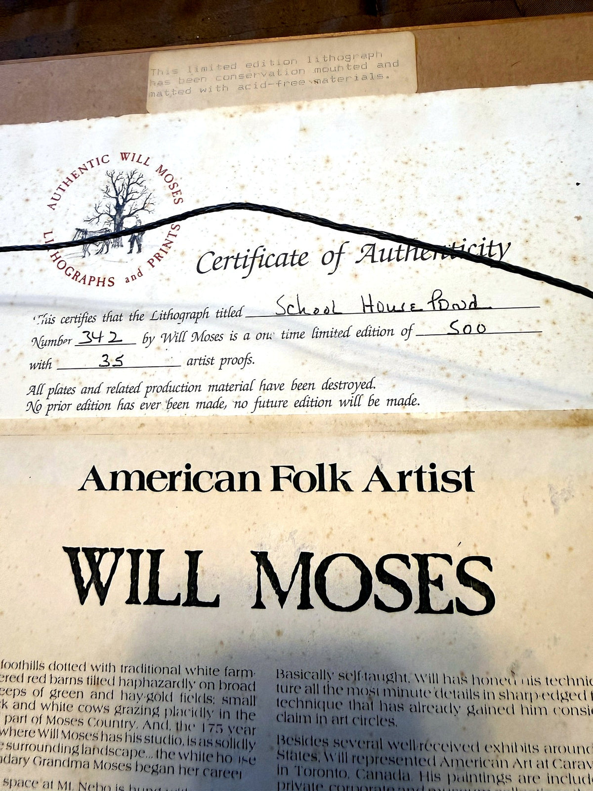 Reverse detail — Certificate of Authenticity header: School House Pond, Number 342 of 500, above the framer's label noting the lithograph has been conservation mounted and matted with acid-free materials