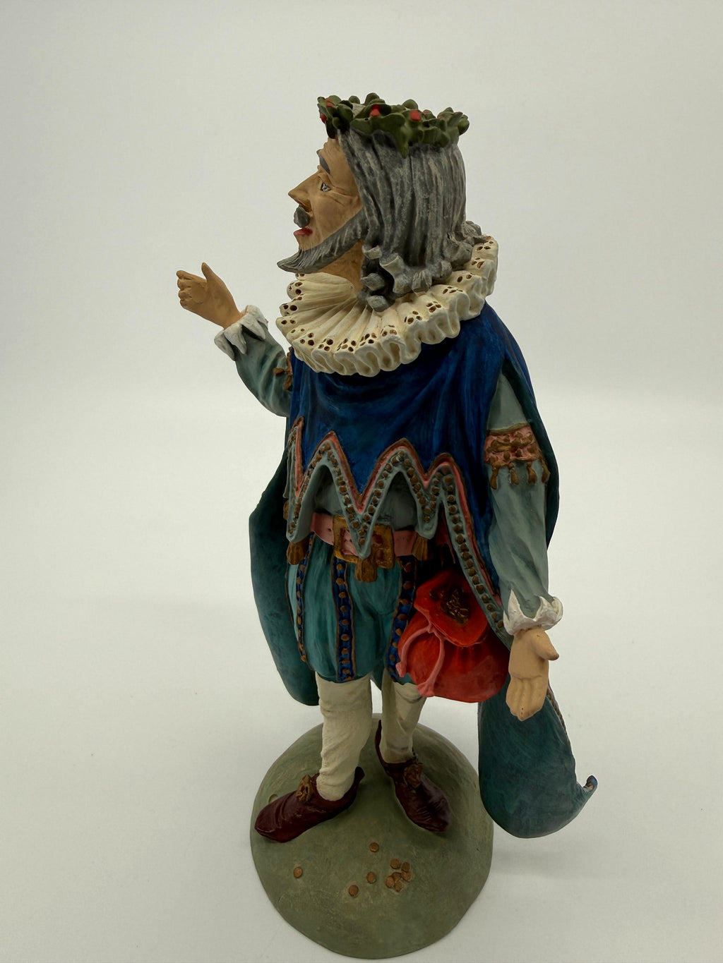 Vintage 1985 Duncan Royale Sir Christmas figurine – front-side view without the staff: raised right hand and flowing cape