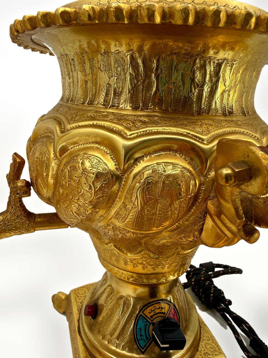 Samovar body close-up – procession band, medallions and control dial with Persian script