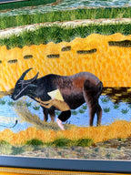 Signed Vietnamese hand-embroidered textile art — water buffalo in rice terraces — detail of the left buffalo, vertical view