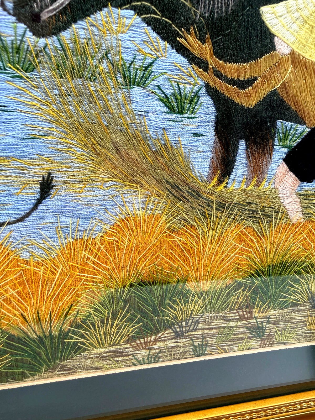 Signed Vietnamese hand-embroidered textile art — water buffalo in rice terraces — detail of the centre — hay, reeds and the farmer's legs in the water