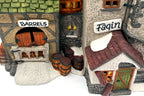 Detail of the hand-painted Barrels and Fagin signs, courtyard barrels and the boarded green door