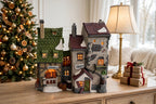 Styled lifestyle photo — Fagin's Hide-A-Way on a console table beside a lamp and wrapped gifts, Christmas tree behind (display inspiration)