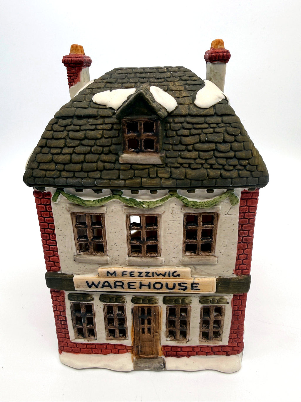 Department 56 M. Fezziwig Warehouse, Dickens' Village, 1986 – front view: M. Fezziwig Warehouse sign, garland swag, slate roof with snow