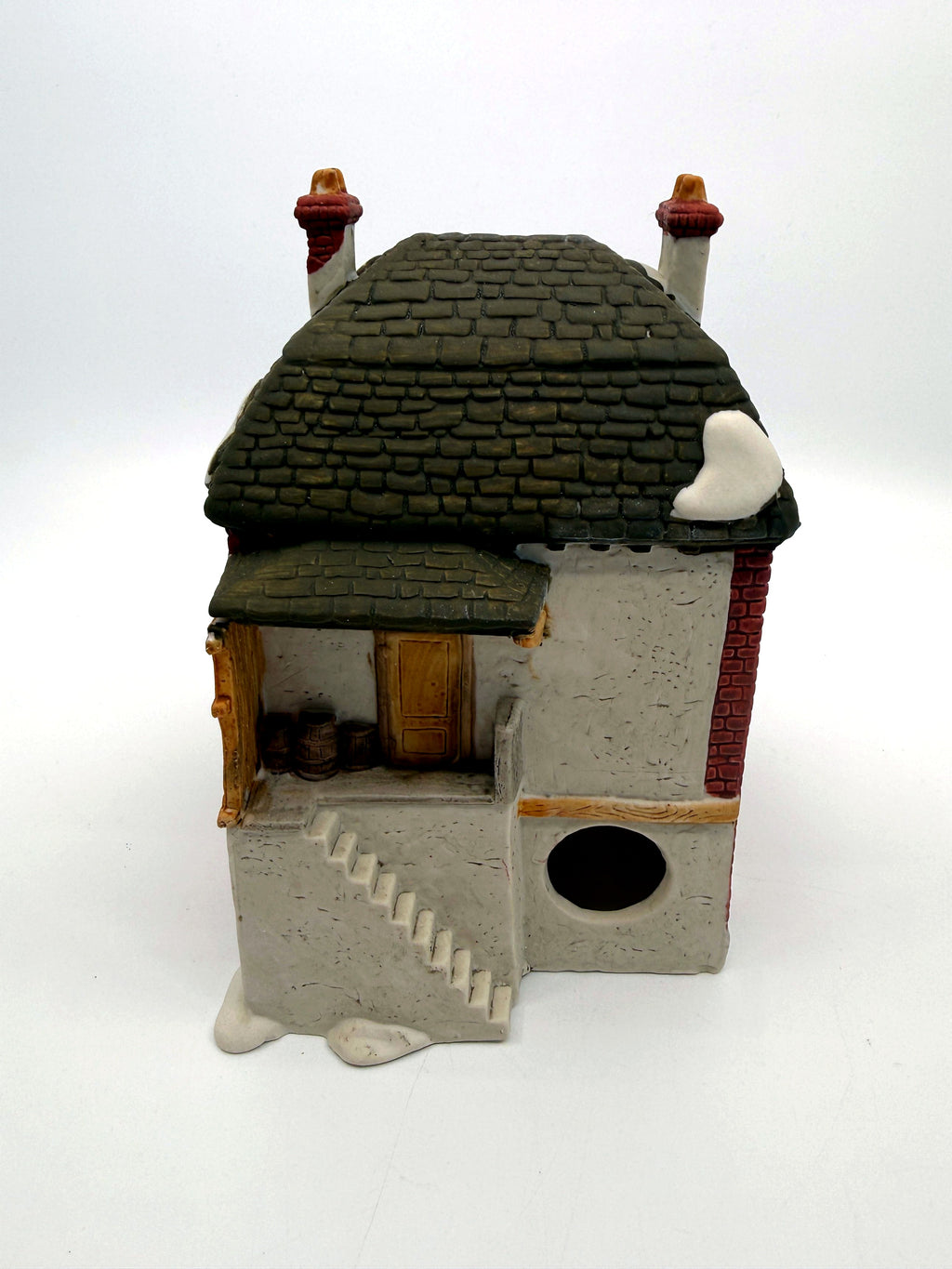 Department 56 M. Fezziwig Warehouse, Dickens' Village, 1986 – back view: raised loading dock with barrels, side stair and light cord opening