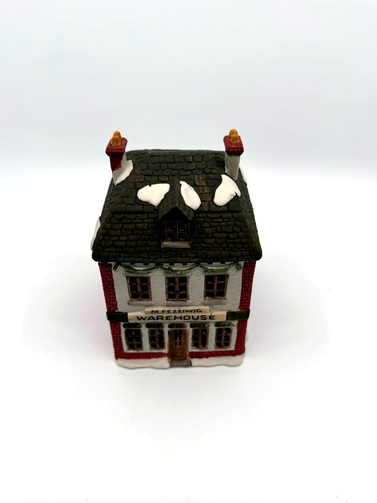 Department 56 M. Fezziwig Warehouse, Dickens' Village, 1986 – front view from above showing the slate roof and chimneys