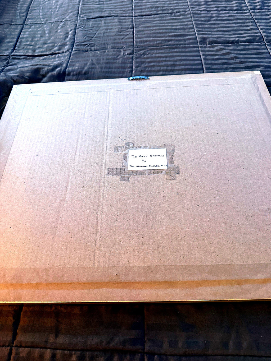 Reverse of the frame — sealed backing with the older handwritten identification label