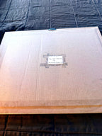 Reverse of the frame — sealed backing with the older handwritten identification label