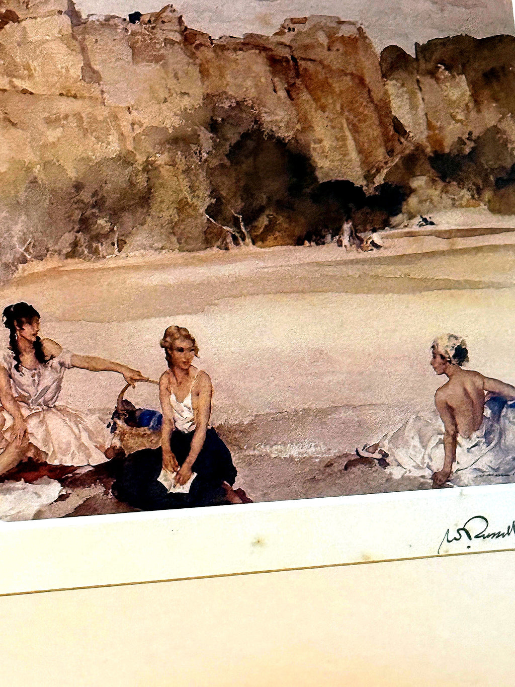 Close-up — the three figures; light foxing spots are visible on the mat border, as described