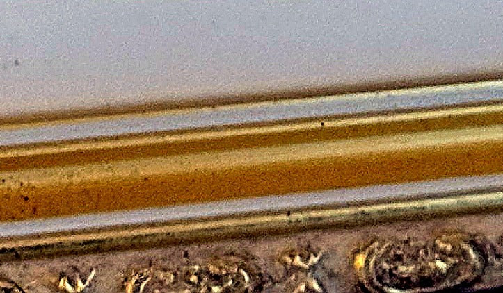 Detail close-up — the printed facsimile signature at the lower right of the print