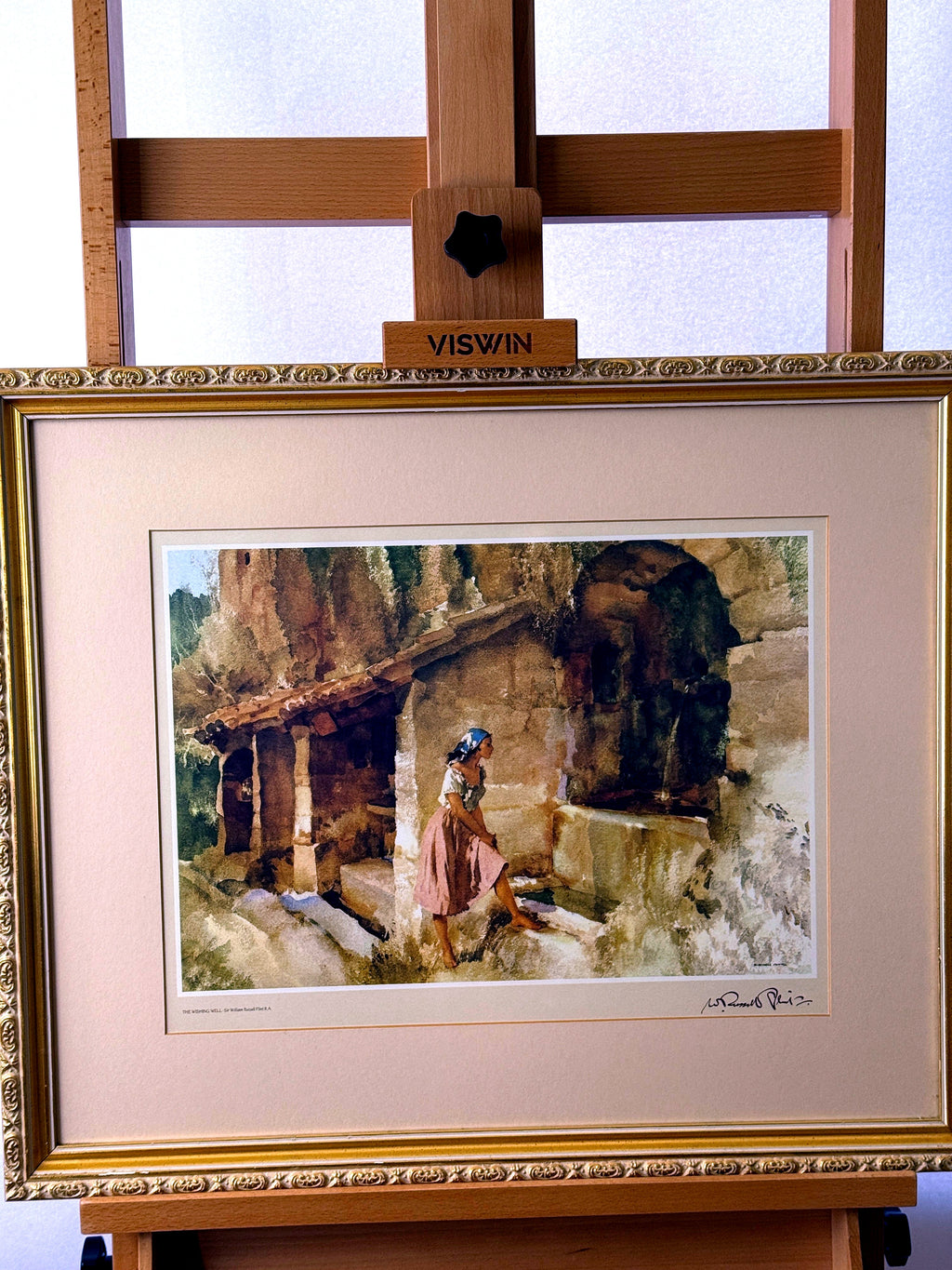 Sir William Russell Flint The Wishing Well framed art print — front view on an easel