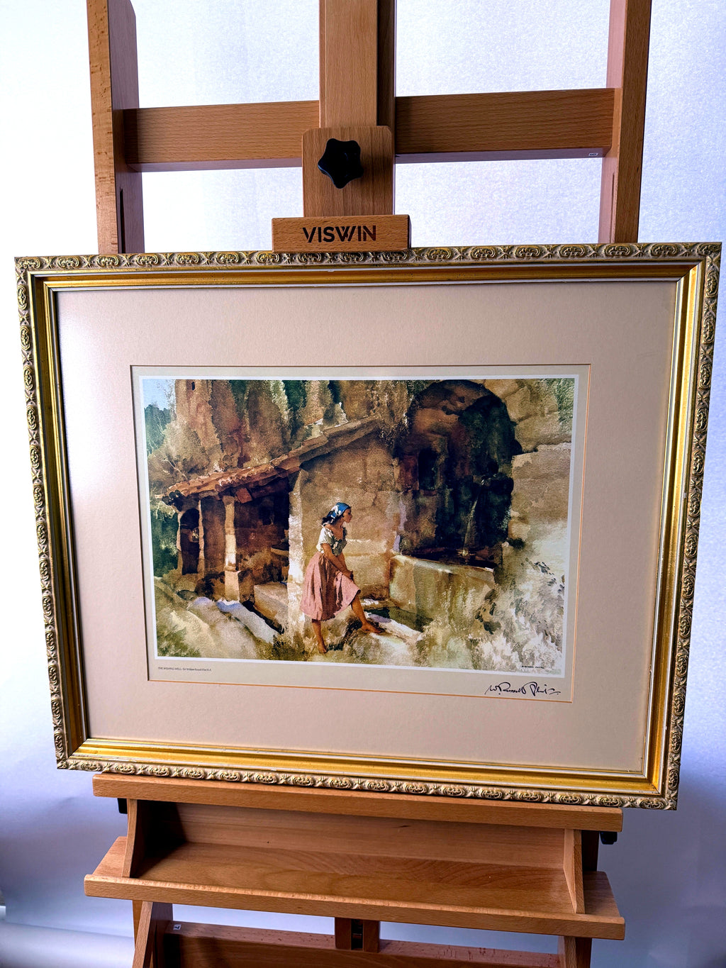 Sir William Russell Flint The Wishing Well framed art print — front view on an easel, straight on