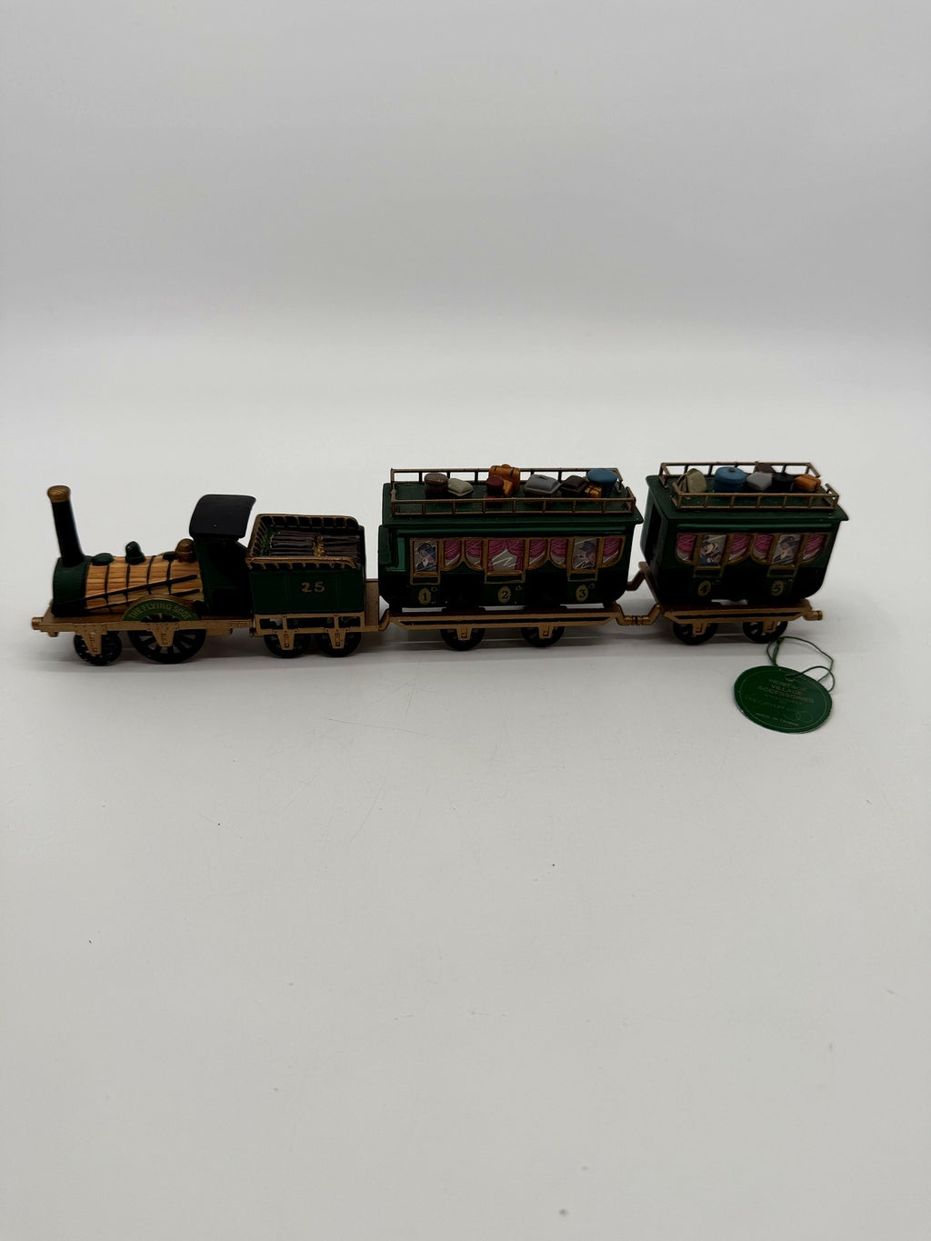 Department 56 Dickens' Village The Flying Scot Train, set of 4 - the complete four-piece train in profile: locomotive, coal tender No. 25 and two passenger coaches, with the original green hangtag