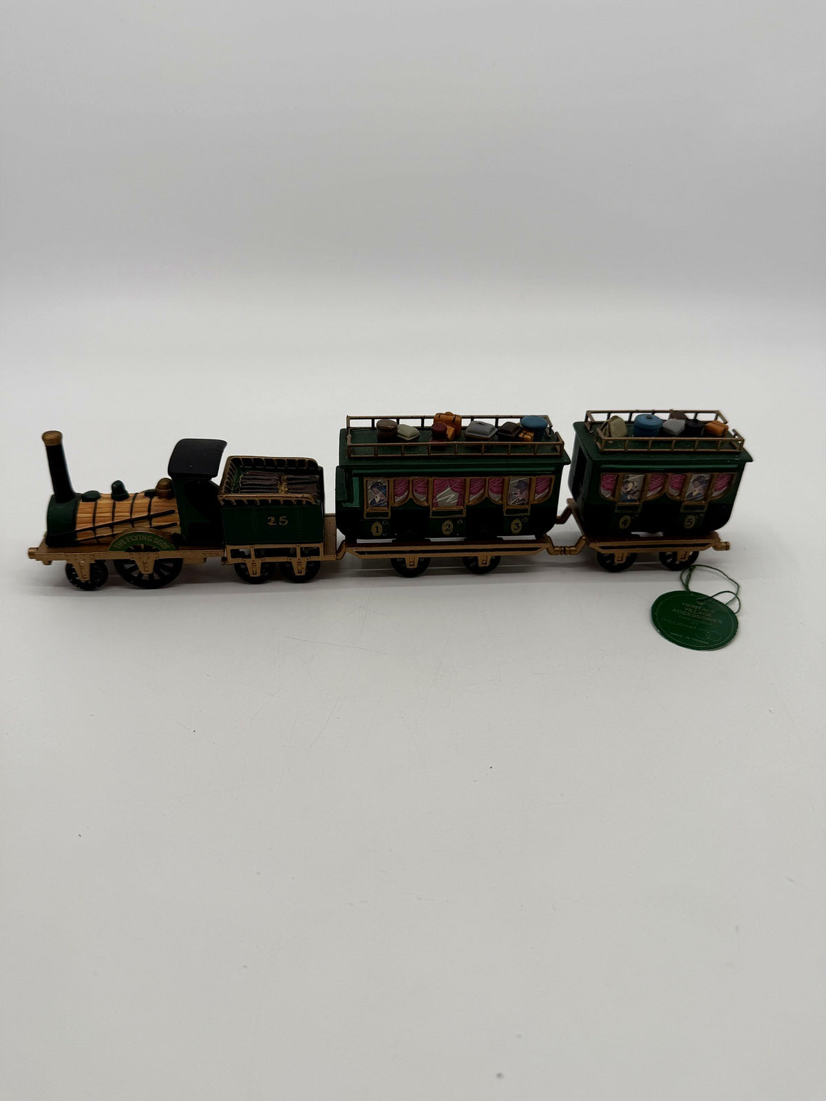 Department 56 Dickens' Village The Flying Scot Train, set of 4 - the complete four-piece train in profile: locomotive, coal tender No. 25 and two passenger coaches, with the original green hangtag