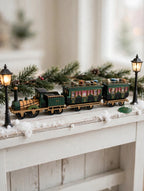 Department 56 Dickens' Village The Flying Scot Train, set of 4 on a shelf between miniature Victorian street lamps (styled display image for inspiration; the train set is the item for sale)
