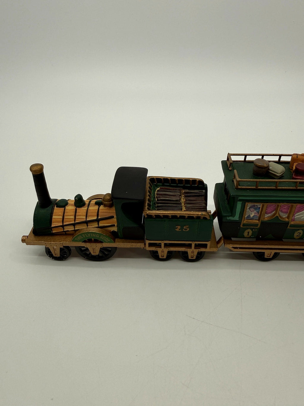 Department 56 Dickens' Village The Flying Scot Train, set of 4 - close view of the steam locomotive with its THE FLYING SCOT nameplate and the coal tender No. 25 loaded with firewood