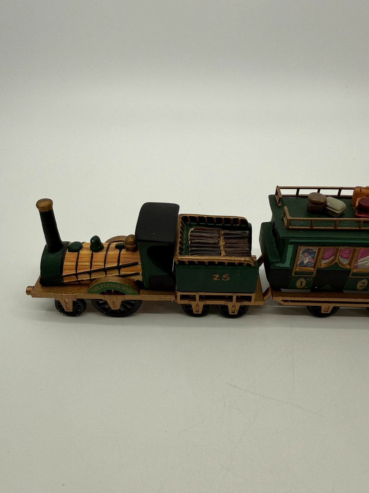 Department 56 Dickens' Village The Flying Scot Train, set of 4 - close view of the steam locomotive with its THE FLYING SCOT nameplate and the coal tender No. 25 loaded with firewood
