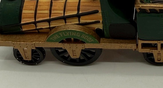 Close-up of the locomotive nameplate - THE FLYING SCOT - over the driving wheel