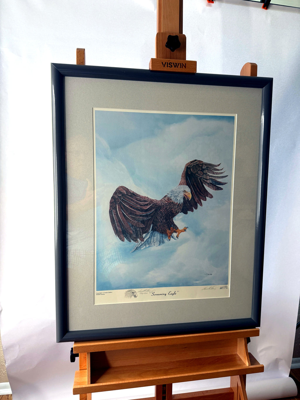 Gerald Fraize Screaming Eagle signed and numbered print, 199 of 500 — front view on an easel