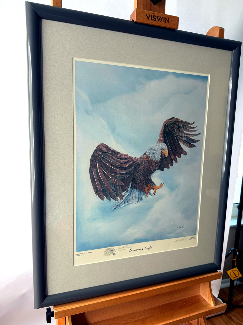 Gerald Fraize Screaming Eagle signed and numbered print, 199 of 500 — front view from a right angle on the easel