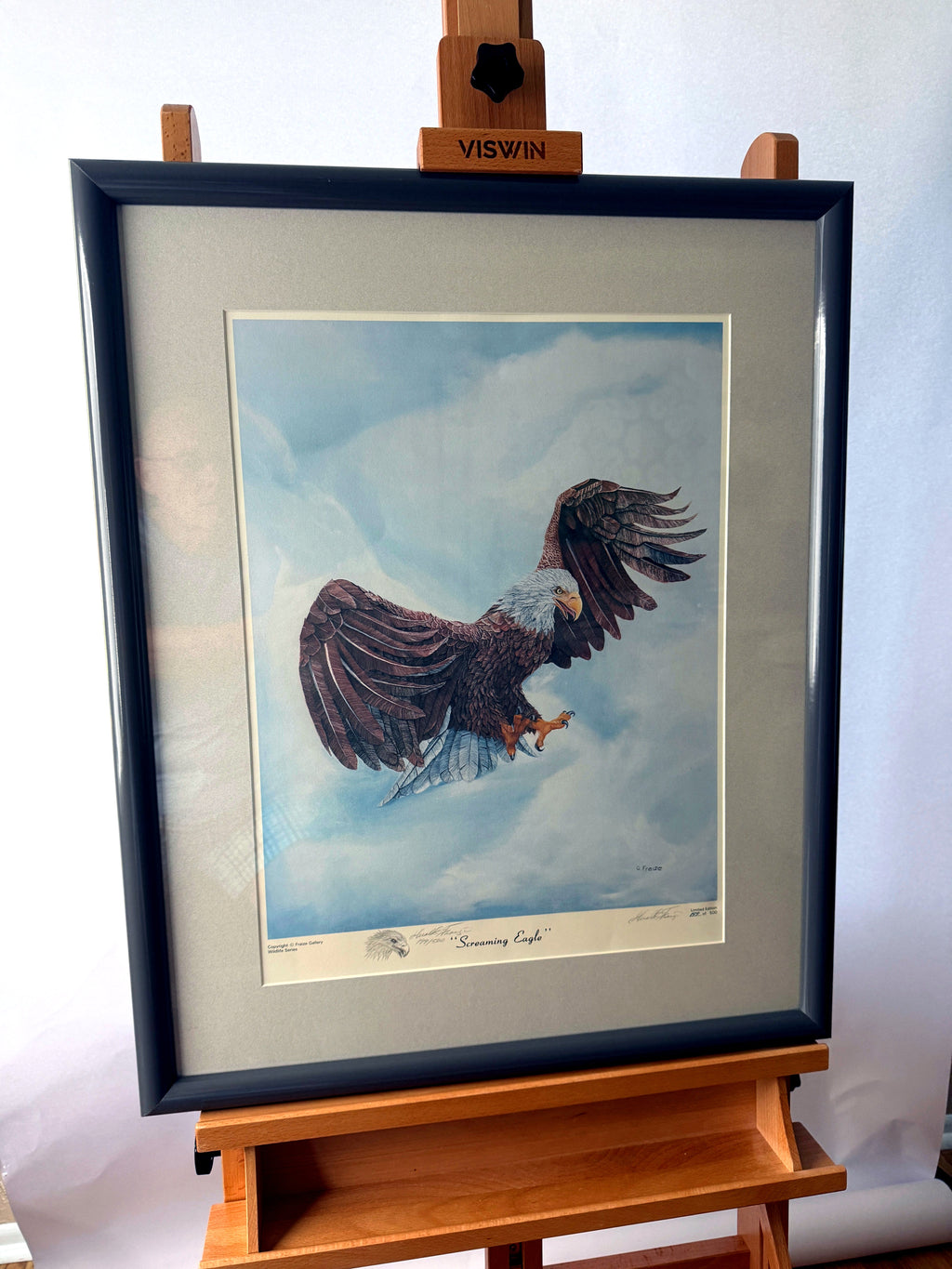 Gerald Fraize Screaming Eagle signed and numbered print, 199 of 500 — front view on an easel