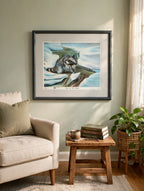 Styled lifestyle photo — the framed Snow In The Smokies print in a cozy reading nook with an armchair and nature books (display inspiration)