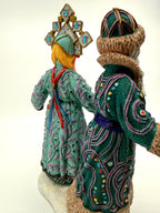 Back three-quarter view of both figures (enhanced)