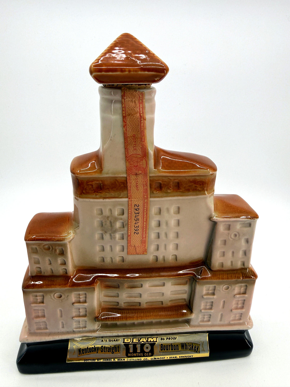 1968 Jim Beam Broadmoor Hotel 50th Anniversary ceramic decanter, front view with original foil label and tax strip