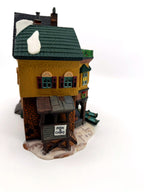 Department 56 Dickens' Village "The Grapes Inn" lighted porcelain building – side view showing the Fish & Chips stand