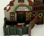 Department 56 Green Gate Cottage – detail of the Green Gate sign, green door, lantern and garden gate