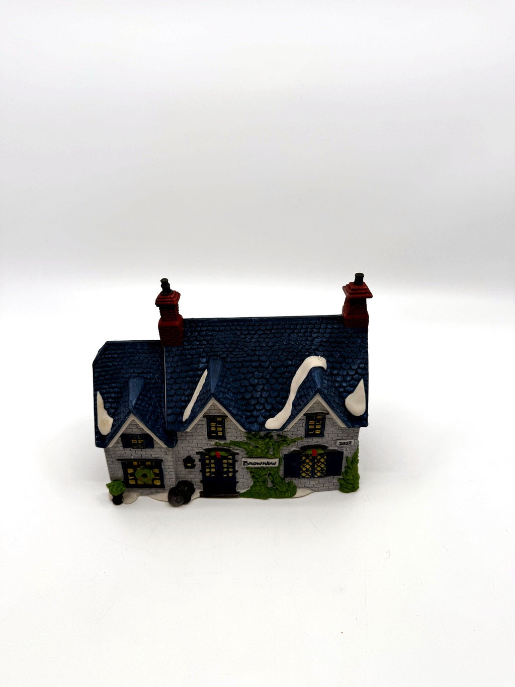 Department 56 Dickens' Village Brownlow House #5553-0, front view — gray stone, deep-blue shingled roof, ivy and Brownlow sign