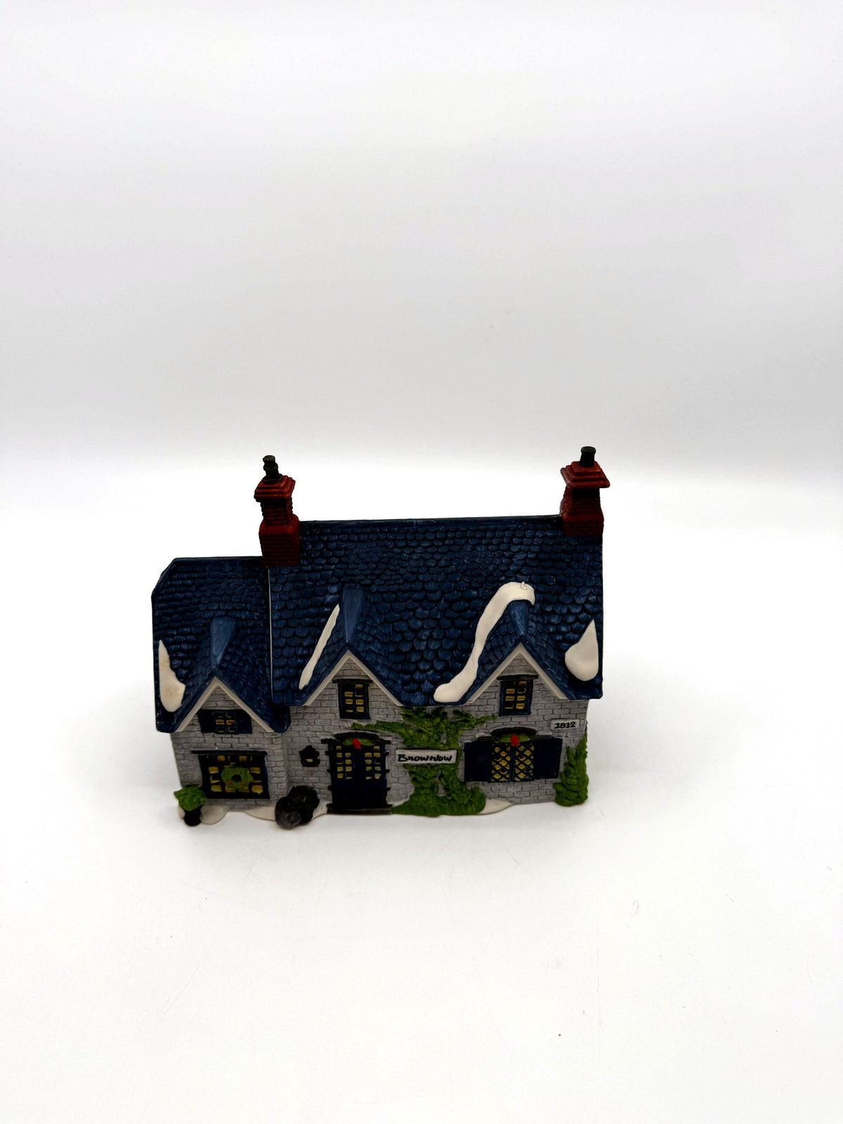 Department 56 Dickens' Village Brownlow House #5553-0, front view — gray stone, deep-blue shingled roof, ivy and Brownlow sign