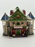 Lemax Carole Towne Child's Wonder Candy Shop lighted Christmas village building, front view — candy-cane columns, CANDY SHOP sign, and two glass bay towers with interior scenes
