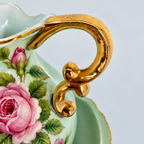 Close-up of hand-painted pink cabbage roses on vintage Lefton China porcelain