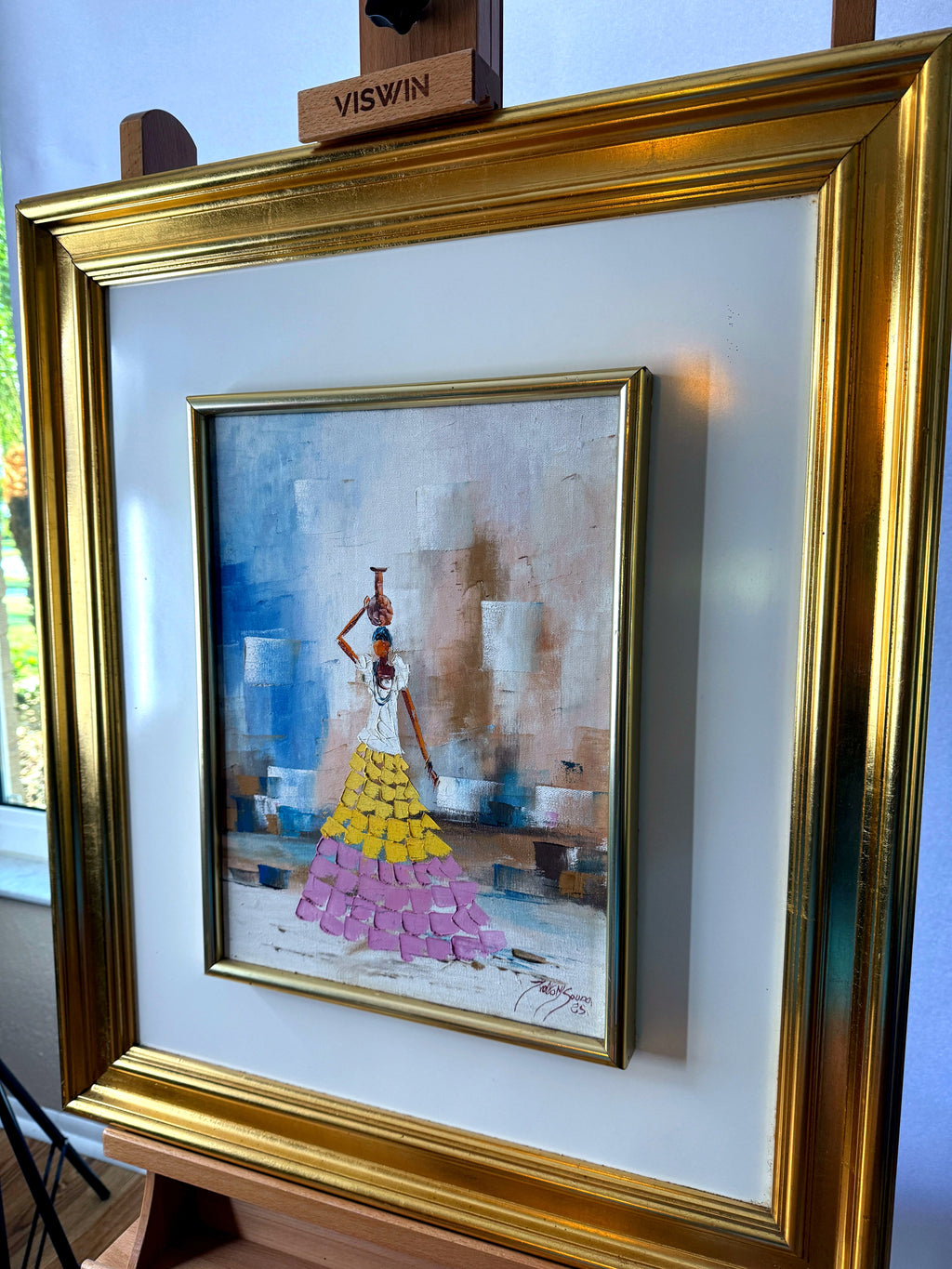 1985 signed impasto figural paintings on canvas — framed pair — the water-carrier painting from a left angle showing the deep gilt frame