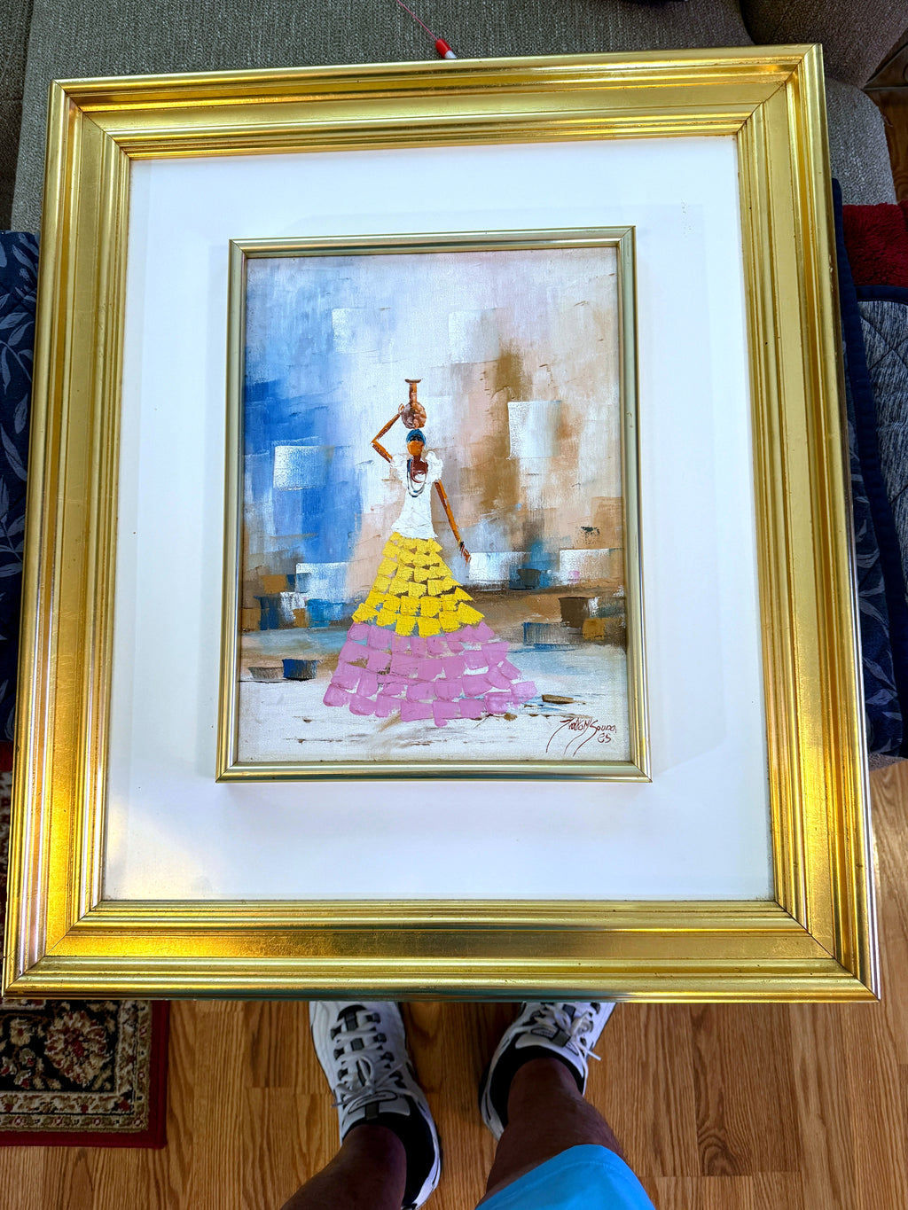 1985 signed impasto figural paintings on canvas — framed pair — the water-carrier painting on an easel, front view
